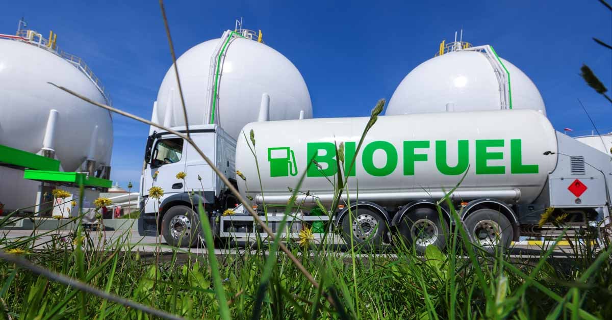 A biofuel tanker in front of a decarbonized fuel production facility.