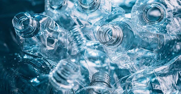 A large pile of empty plastic water bottles.