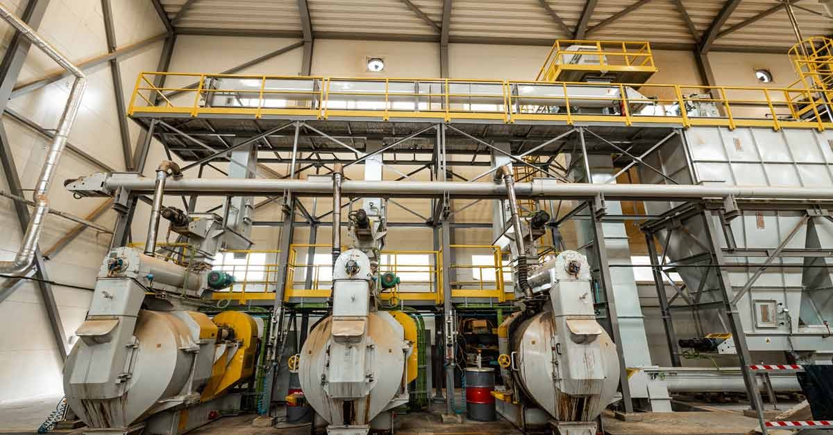 Machinery used to convert woody biomass into pellets to be used in advanced biofuels.