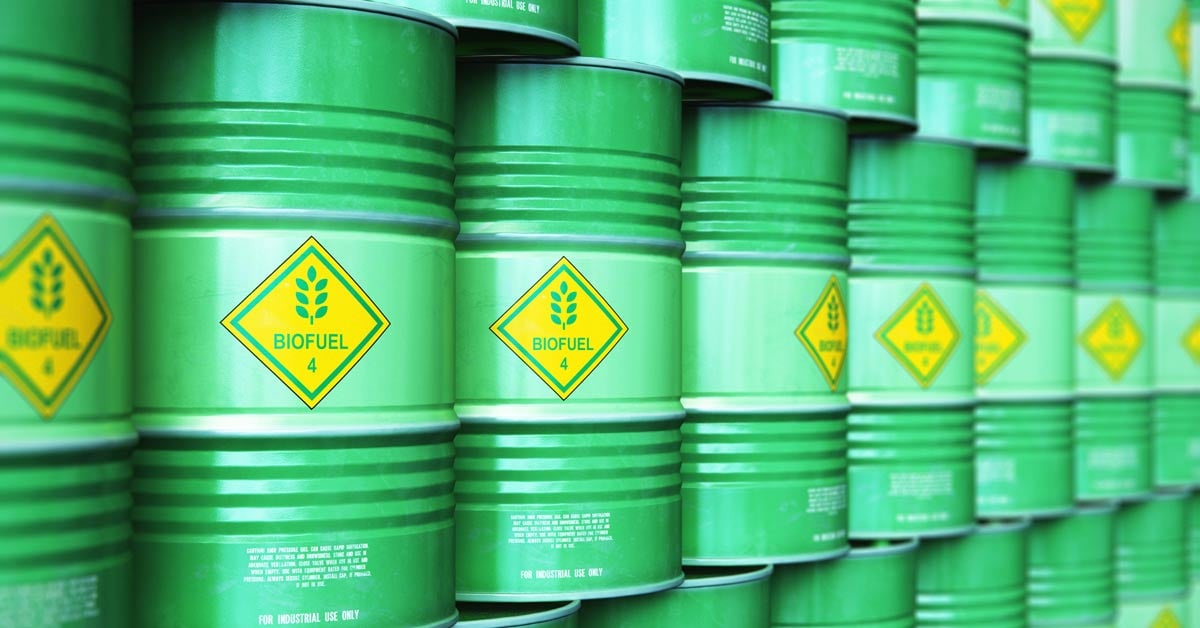 A stack of green barrels labeled Biofuel.