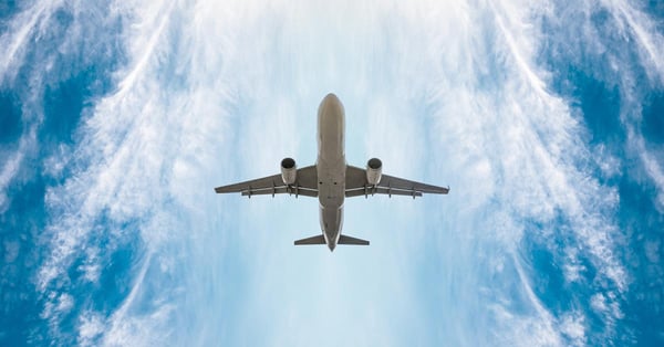 Upward look of an airplane flying in the sky.