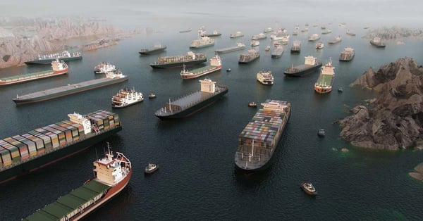 Multiple ships all backed up in the Strait of Hormuz.