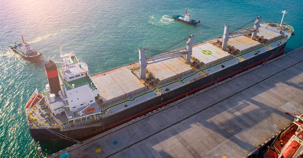 A shipping vessel docked at a port.