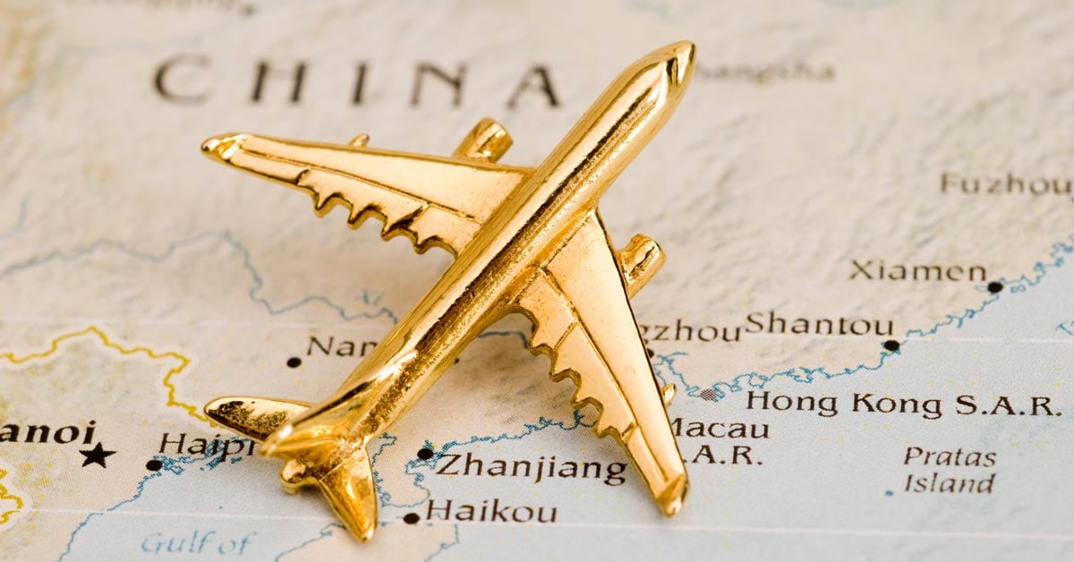 A golden airplane token atop a map of China.