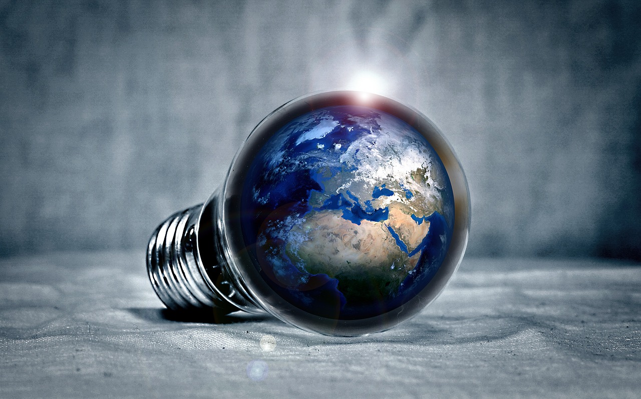 A light bulb with an image of planet earth inside it.