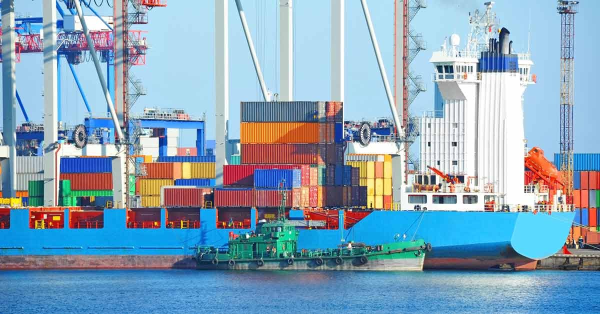 A cargo ship loaded with various shipping containers.