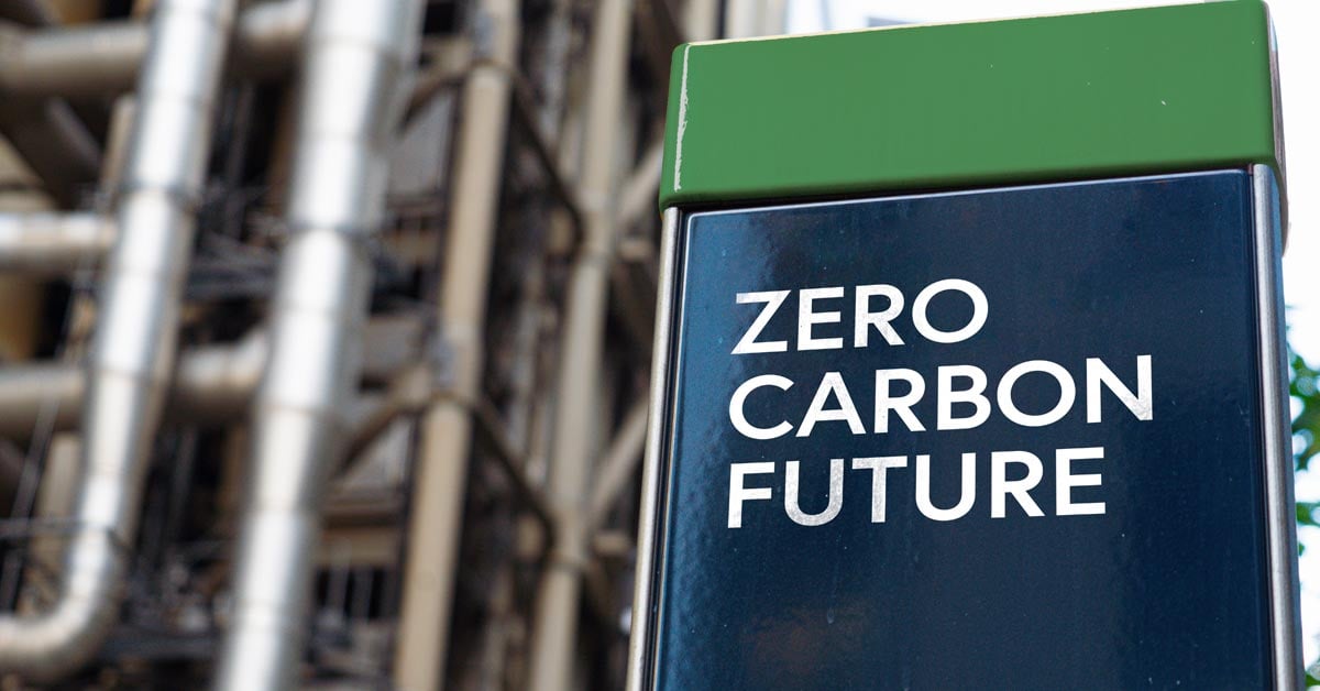 Zero Carbon Future on a sign in front of an Industrial building.