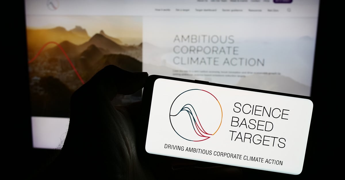 Logo of Science Based Targets Initiative (SBTi) on a mobile phone as the company announces that it will allow carbon credits.