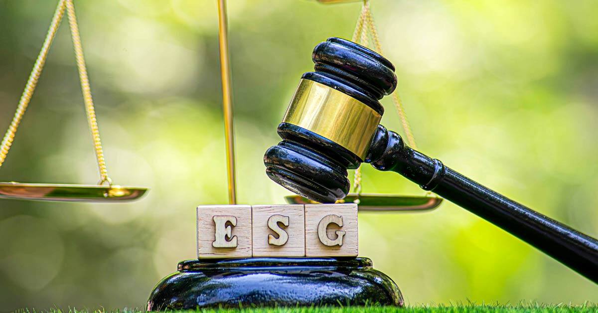 A gavel on blocks saying ESG with scales of justice, indicating ESG regulations and mandates.