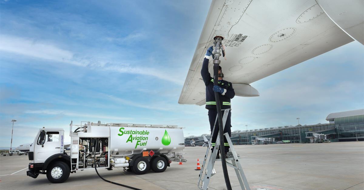 An airplane being fueled by sustainable aviation fuel, or SAF.