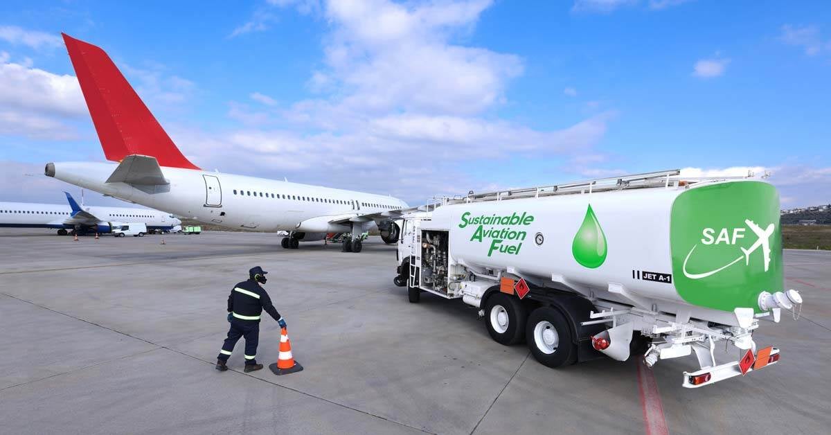 An airplane on an airfield being fueled by a fuel truck using sustainable aviation fuel.