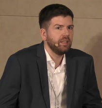 Nicolas Hark Silvia-Maltagliati of the nova Institute pictured on stage at the European Bioplastics Conference in Berlin in December 2023. 