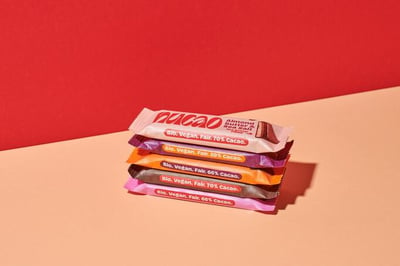 5 Nuco chocolate bars in paper packaging.