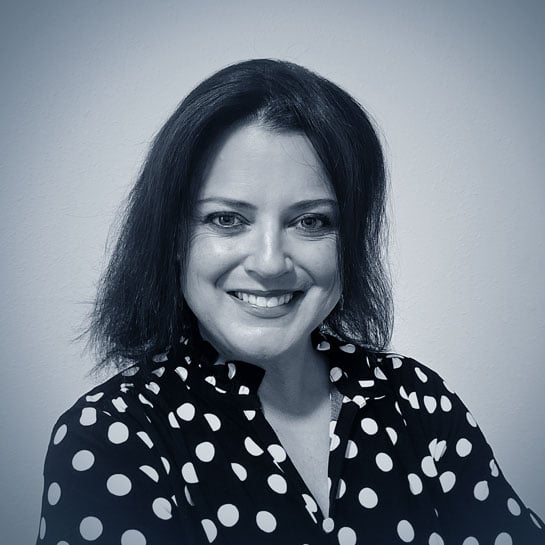 Headshot of Ashley Rock in black and white. 