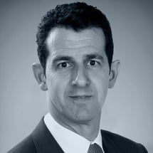 A black and white head and shoulders photograph of Tecnon OrbiChem business manager Javier Rivera.