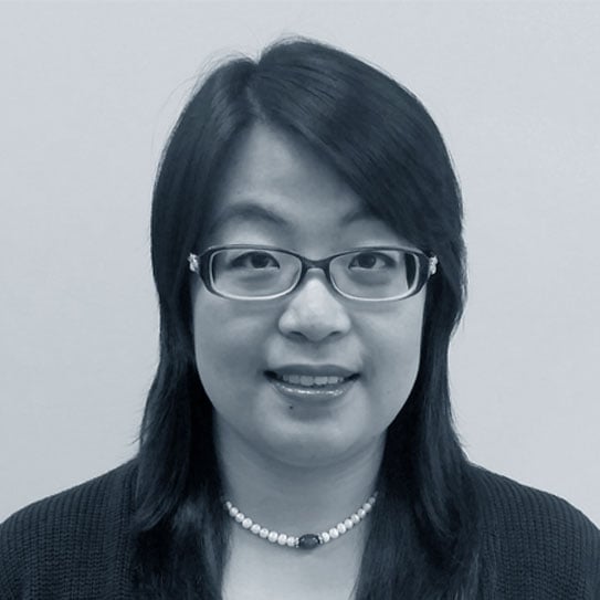 Headshot of Zhen (Carol) McKnight in black and white. 