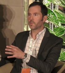 Rhodes Yepsen, Biodegradable Products Institute Executive Director pictured on stage at the European Bioplastics Conference in Berlin in December 2023.