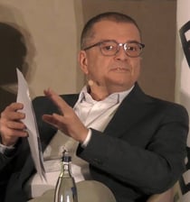 Roberto Ferrigno, an organiser of Karin Molenveld from Wageningen head of affairs at European Bioplastics pictured on stage at its conference in Berlin in December 2023.