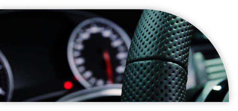 Close-up of steering wheel in a car. 