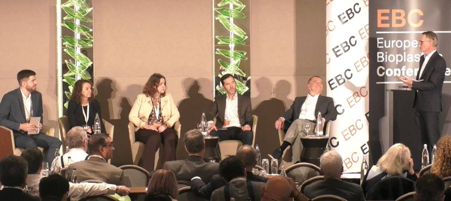 Five panel members on the stage at the European Bioplastics Conference in Berlin in December 2023.