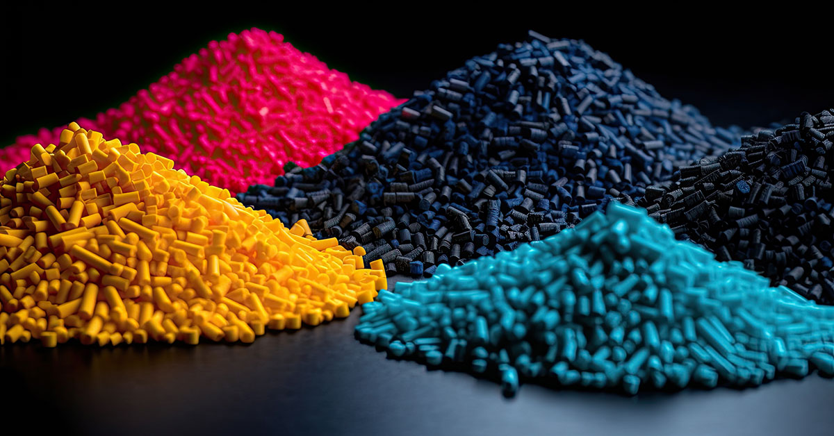 Close-up of multicolor synthetic resin granules with a dark background