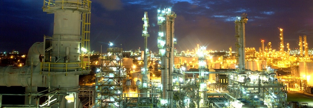 Chemical manufacturing plant at night. 